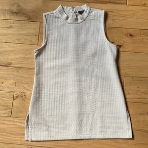 Cream sleeveless zippered neck top